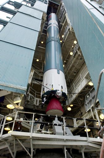 VANDENBERG AFB, CALIF. -   The first stage of the Delta II launch vehicle for the Gravity Probe B experiment is lifted up the mobile service tower on Space Launch Complex 2, Vandenberg Air Force Base, Calif.  The Gravity Probe B will launch a payload of four gyroscopes into low-Earth polar orbit to 