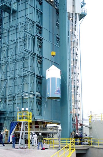 VANDENBERG AFB, CALIF. -  The interstage of the Delta II launch vehicle for the Gravity Probe B experiment is lifted up the mobile service tower on Space Launch Complex 2, Vandenberg Air Force Base, Calif.  It will enclose the second stage.  The Gravity Probe B will launch a payload of four gyroscop