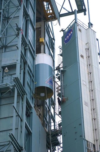 VANDENBERG AFB, CALIF. -   The interstage of the Delta II launch vehicle for the Gravity Probe B experiment is moved into the mobile service tower on Space Launch Complex 2, Vandenberg Air Force Base, Calif., where it will be mated with the second stage.  The Gravity Probe B will launch a payload of