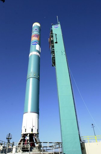 VANDENBERG AFB, CALIF. -  The mobile service tower on Space Launch Complex 2, Vandenberg Air Force Base, Calif., rolls back from the Delta II rocket that will launch the Gravity Probe B experiment.  The Gravity Probe B will launch a payload of four gyroscopes into low-Earth polar orbit to test two e