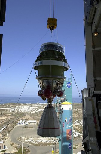 VANDENBERG AFB, CALIF. -  Viewed from inside, the second stage of the Delta II launch vehicle for the Gravity Probe B experiment is lifted up the mobile service tower on Space Launch Complex 2, Vandenberg Air Force Base, Calif.   Behind it is the first stage of the Delta II.  The Gravity Probe B wil