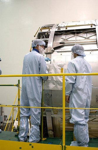 KENNEDY SPACE CENTER, FLA. -  In the Space Station Processing Facility, STS-117 Mission Specialist James Reilly works with the Japanese Experiment Module (JEM).  Reilly and STS-115 Mission Specialist Joseph Tanner are at KSC for equipment familiarization, a routine part of astronaut training and lau