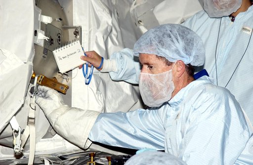 KENNEDY SPACE CENTER, FLA. - In the Space Station Processing Facility, STS-117 Mission Specialist James Reilly  works with equipment in the Japanese Experiment Module (JEM) as part of training for ExtraVehicular Activity (EVA).  Equipment familiarization is a routine part of astronaut training and l