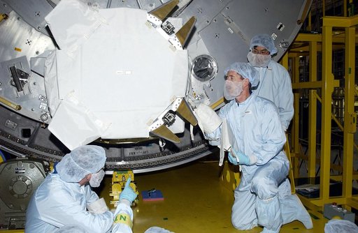 KENNEDY SPACE CENTER, FLA. - In the Space Station Processing Facility, STS-117 Mission Specialist James Reilly (right, in front) works with equipment in the Japanese Experiment Module (JEM) as part of training for ExtraVehicular Activity (EVA). At left is STS-115 Mission Specialist Joseph Tanner.  E
