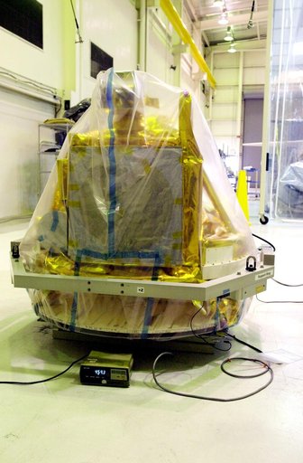 VANDENBERG AIR FORCE BASE, CALIF.-  A covered SciSat-1 spacecraft sits on a test stand at Vandenberg Air Force Base, Calif.  The solar arrays will be attached and the communications systems checked out.   The SciSat-1 weighs approximately 330 pounds and after launch will be placed in a 400-mile-high