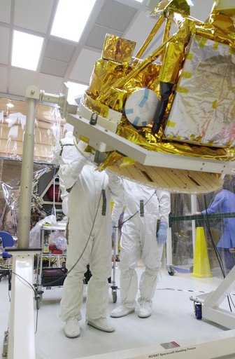 VANDENBERG AIR FORCE BASE, CALIF. -  With its cover removed, the SciSat-1 spacecraft is rotated.  The solar arrays will be attached and the communications systems checked out.   The SciSat-1 weighs approximately 330 pounds and after launch will be placed in a 400-mile-high polar orbit to investigate