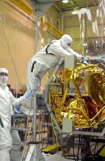 VANDENBERG AIR FORCE BASE, CALIF. -  At Vandenberg AFB, Calif., a solar array is installed on the SciSat-1 spacecraft.  The SciSat-1 weighs approximately 330 pounds and after launch will be placed in a 400-mile-high polar orbit to investigate processes that control the distribution of ozone in the u