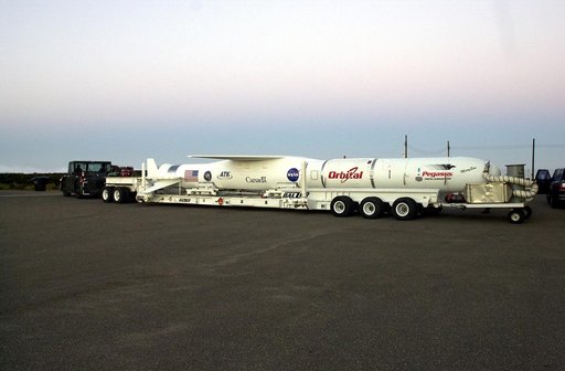 VANDENBERG AIR FORCE BASE, CALIF. -  The SciSat-1 payload, with fairing installed and attached to its Pegasus launch vehicle, begins rollout to the hot pad and mating to the L-1011 carrier aircraft.  The SciSat-1 weighs approximately 330 pounds and after launch will be placed in a 400-mile-high pola