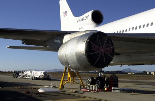 VANDENBERG AIR FORCE BASE, CALIF. - The SciSat-1 payload, with fairing installed and attached to its Pegasus launch vehicle, arrives at the pad for mating to the L-1011 carrier aircraft.  The SciSat-1 weighs approximately 330 pounds and after launch will be placed in a 400-mile-high polar orbit to i