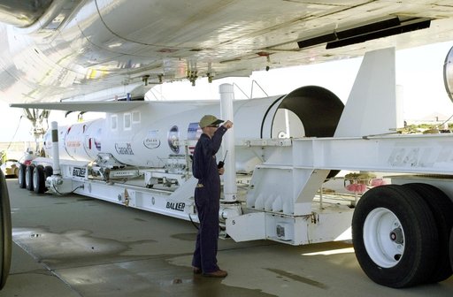 VANDENBERG AIR FORCE BASE, CALIF. -  The Pegasus transporter, with its cargo of  the SciSat-1 payload and Pegasus launch vehicle, moves under the L-1011 carrier aircraft for matting.  The SciSat-1 weighs approximately 330 pounds and after launch will be placed in a 400-mile-high polar orbit to inves