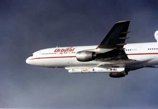 VANDENBERG AIR FORCE BASE, CALIF. -  The L-1011 carrier aircraft is in flight with its cargo underneath of the Pegasus launch vehicle and SciSat-1 spacecraft.  The SciSat-1 weighs approximately 330 pounds and after launch will be placed in a 400-mile-high polar orbit to investigate processes that co