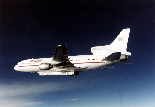 VANDENBERG AIR FORCE BASE, CALIF. -  The L-1011 carrier aircraft is in flight with its cargo of the Pegasus launch vehicle and SciSat-1 spacecraft underneath.  The SciSat-1 weighs approximately 330 pounds and after launch will be placed in a 400-mile-high polar orbit to investigate processes that co