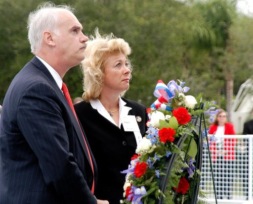 KENNEDY SPACE CENTER, FLA. -  NASA's Associate Administrator for Space Flight William Readdy and Evelyn Husband, widow of astronaut Rick Husband, place a ceremonial wreath at the Space Mirror Memorial at the Kennedy Space Center Visitor Complex.  During this dedication ceremony, the names of the STS