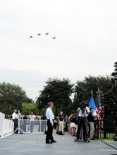 KENNEDY SPACE CENTER, FLA. -  NASA T-38 jets fly over the Space Mirror Memorial at the Kennedy Space Center Visitor Complex in the Missing Man Formation. During this dedication ceremony, the names of the STS-107 astronauts who lost their lives during the Columbia accident -- Rick Husband, Willie McC