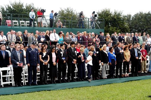 KENNEDY SPACE CENTER, FLA. -  Family members of the STS-107 astronauts and other dignitaries attend a dedication ceremony at the Space Mirror Memorial at the Kennedy Space Center Visitor Complex.  During this solemn event, the names of the STS-107 astronauts who lost their lives during the Columbia 