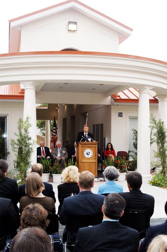 KENNEDY SPACE CENTER, FLA. -- Dr. Jonathan Clark, husband of STS-107 astronaut Laurel Clark, addresses the family members of the STS-107 astronauts, other dignitaries, members of the university community and the public gathered for the dedication ceremony of the Columbia Village at the Florida Insti