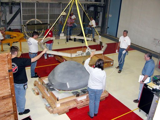KENNEDY SPACE CENTER, FLA. -  In the Orbiter Processing Facility, workers remove the overhead crane from the nose cap that was removed from Atlantis.   The reinforced carbon-carbon (RCC) nose cap is being sent to the original manufacturing company, Vought in Ft. Worth, Texas, a subsidiary of Lockhee