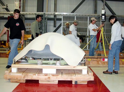 KENNEDY SPACE CENTER, FLA. -  In the Orbiter Processing Facility, packing material is placed over the nose cap that was removed from Atlantis.   The reinforced carbon-carbon (RCC) nose cap is being sent to the original manufacturing company, Vought in Ft. Worth, Texas, a subsidiary of Lockheed Marti