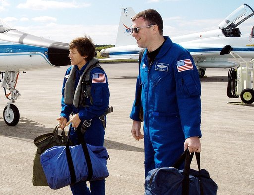 KENNEDY SPACE CENTER, FLA. - Walking away from the T-38 jet aircraft that brought them to KSC are STS-114 Mission Specialist Wendy Lawrence and Pilot James Kelly.  Lawrence is a new addition to the crew.  They and other crew members are at KSC to take part in crew equipment and orbiter familiarizati
