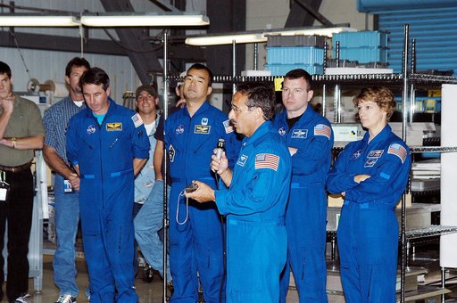 KENNEDY SPACE CENTER, FLA. -  STS-114 Mission Specialist Charles Camarda talks to workers in the Orbiter Processing Facility.  Behind him (left to right) are other crew members: Mission Specialists Stephen Robinson and Soichi Noguchi, Pilot James Kelly and Commander Eileen Collins.  Camarda is a new