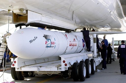 VANDENBERG AIR FORCE BASE, CALIF. -    Workers mate the Pegasus , with its cargo of the SciSat-1 payload to the L-1011 carrier aircraft.  The SciSat-1 weighs approximately 330 pounds and after launch will be placed in a 400-mile-high polar orbit to investigate processes that control the distribution