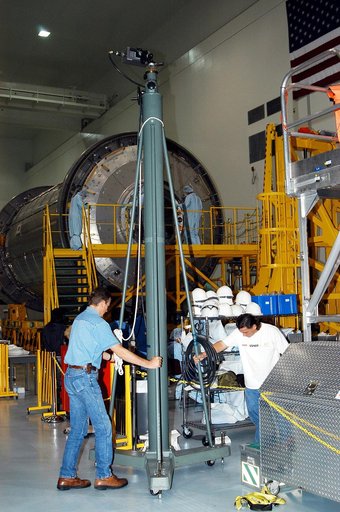 KENNEDY SPACE CENTER, FLA. - In the Space Station Processing Facility, technicians with The Boeing Company move an infrared camera into position near the Japanese Experiment Module (JEM) for pre-assembly measurements.  Developed by the Japan Aerospace Exploration Agency (JAXA), the JEM will enhance 