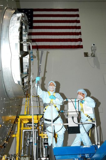 KENNEDY SPACE CENTER, FLA. -  In the Space Station Processing Facility, technicians begin pre-assembly measurements on the Japanese Experiment Module (JEM).  Developed by the Japan Aerospace Exploration Agency (JAXA), the JEM will enhance the unique research capabilities of the orbiting complex by p
