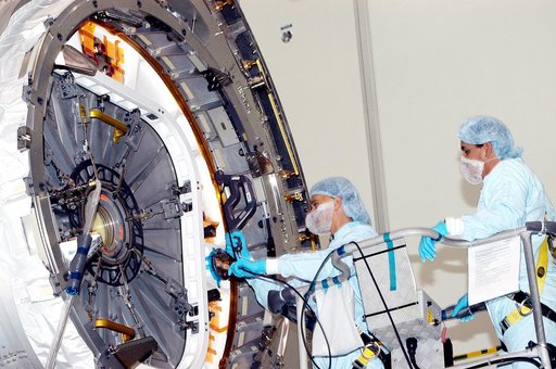 KENNEDY SPACE CENTER, FLA. - In the Space Station Processing Facility, technicians take readings for pre-assembly measurements on the Japanese Experiment Module (JEM).  Developed by the Japan Aerospace Exploration Agency (JAXA), the JEM will enhance the unique research capabilities of the orbiting c