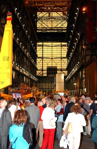 KENNEDY SPACE CENTER, FLA. - Members of the North American Treaty Organization (NATO) Parliamentary Assembly visit the Vehicle Assembly Building during their tour of KSC. In the background is a segment of a solid rocket booster. The Parliamentarians are meeting in Orlando this year for their 49th an