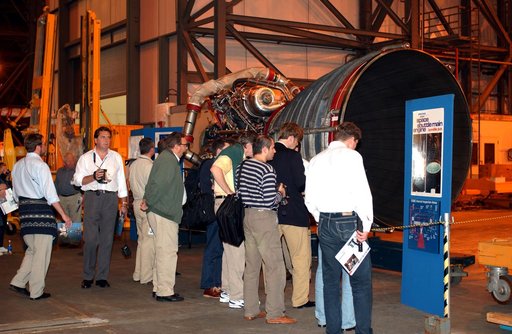 KENNEDY SPACE CENTER, FLA. - Members of the North American Treaty Organization (NATO) Parliamentary Assembly  get a close look at a Space Shuttle main engine in the Vehicle Assembly Building during their tour of KSC.   The Parliamentarians are meeting in Orlando this year for their 49th annual gathe