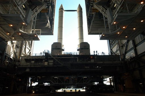 KENNEDY SPACE CENTER, FLA. -   The crawler transporter is slowly moving the Mobile Launcher Platform (MLP), carrying a set of twin solid rocket boosters, out of the Vehicle Assembly Building (VAB) in support of engineering analysis vibration tests on the crawler and MLP. The crawler is moving at var