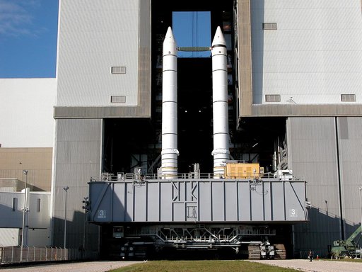 KENNEDY SPACE CENTER, FLA. -  As the crawler transporter slowly moves the Mobile Launcher Platform (MLP) out of the Vehicle Assembly Building, the two solid rocket boosters on top are framed in the doorway.  The move is in support of engineering analysis vibration tests on the crawler and MLP. The c