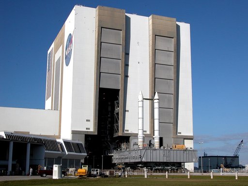 KENNEDY SPACE CENTER, FLA. -  The crawler transporter slowly moves the Mobile Launcher Platform (MLP), carrying a set of twin solid rocket boosters, out of the Vehicle Assembly Building (VAB) in support of engineering analysis vibration tests on the crawler and MLP.   The crawler is moving at variou
