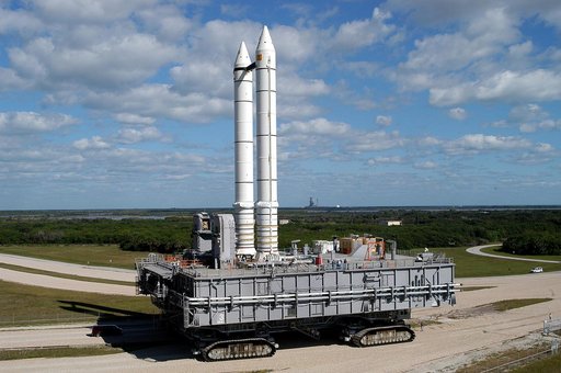 KENNEDY SPACE CENTER, FLA. -  Mobile Launcher Platform (MLP) number 3 and a set of twin solid rocket boosters, atop the crawler-transporter, inch along the crawlerway in support of the second engineering analysis vibration test on the crawler and MLP. The crawler is moving at various speeds up to 1 