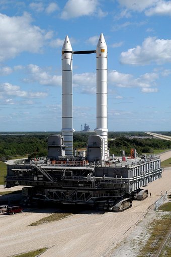 KENNEDY SPACE CENTER, FLA. -  Mobile Launcher Platform (MLP) number 3 and a set of twin solid rocket boosters, atop the crawler-transporter, inch along the crawlerway in support of the second engineering analysis vibration test on the crawler and MLP. The crawler is moving at various speeds up to 1 