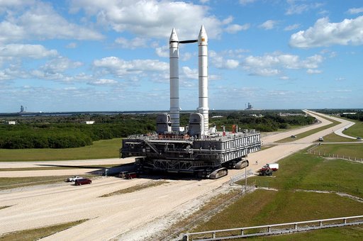 KENNEDY SPACE CENTER, FLA. -  Mobile Launcher Platform (MLP) number 3 and a set of twin solid rocket boosters, atop the crawler-transporter, inch along the crawlerway in support of the second engineering analysis vibration test on the crawler and MLP. The crawler is moving at various speeds up to 1 