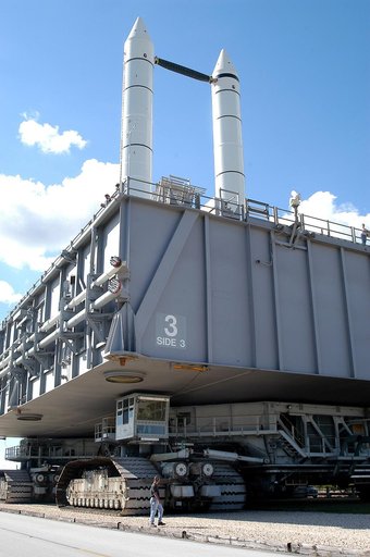 KENNEDY SPACE CENTER, FLA. - A Kennedy Space Center technician monitors the performance of a crawler-transporter as it moves Mobile Launcher Platform (MLP) number 3, with a set of twin solid rocket boosters bolted atop, to the intersection in the crawlerway during the second engineering analysis vib