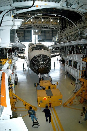 KENNEDY SPACE CENTER, FLA. - Workers prepare to tow the Space Shuttle orbiter Atlantis from the Orbiter Processing Facility (OPF) to the Vehicle Assembly Building (VAB). The move will allow work to be performed in the OPF that can only be accomplished while the bay is empty. Work scheduled in the pr