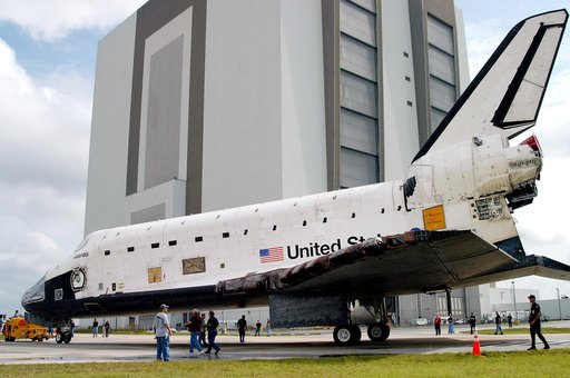 KENNEDY SPACE CENTER, FLA. - The Space Shuttle orbiter Atlantis approaches the Vehicle Assembly Building (VAB).  It is being towed from the Orbiter Processing Facility (OPF) to allow work to be performed in the bay that can only be accomplished while it is empty. Work scheduled in the processing fac
