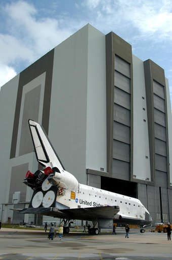 KENNEDY SPACE CENTER, FLA. - The Space Shuttle orbiter Atlantis nears the Vehicle Assembly Building (VAB).  It is being towed from the Orbiter Processing Facility (OPF) to allow work to be performed in the bay that can only be accomplished while it is empty. Work scheduled in the processing facility