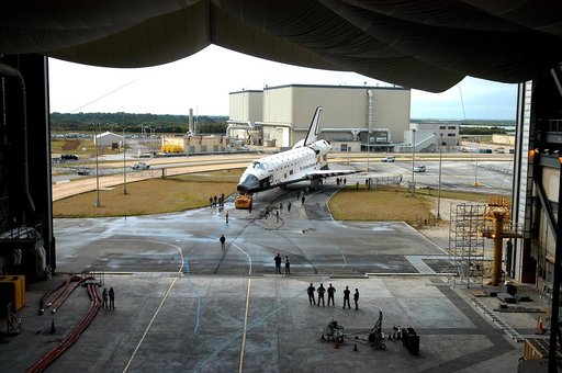 KENNEDY SPACE CENTER, FLA. - The Space Shuttle orbiter Atlantis approaches high bay 4 of the Vehicle Assembly Building (VAB).  It was towed from the Orbiter Processing Facility (OPF) to allow work to be performed in the bay that can only be accomplished while it is empty. Work scheduled in the proce