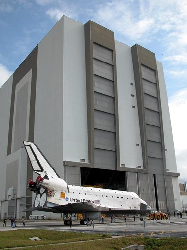 KENNEDY SPACE CENTER, FLA. - The Space Shuttle orbiter Atlantis approaches the Vehicle Assembly Building (VAB) high bay 4.  It is being towed from the Orbiter Processing Facility (OPF) to allow work to be performed in the bay that can only be accomplished while it is empty. Work scheduled in the pro