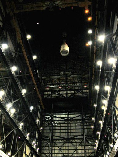KENNEDY SPACE CENTER, FLA. -  In the Vehicle Assembly Building, after being removed from the solid rocket booster (SRB), the forward assembly is lowered from high above the transfer aisle.  The destacking is part of time and cycle activities.  The SRB was part of the stack on Atlantis originally sch