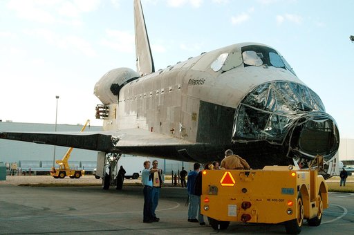 KENNEDY SPACE CENTER, FLA. -  The orbiter Atlantis is backed out of the Vehicle Assembly Building for transfer back to the Orbiter Processing Facility.  Atlantis spent 10 days in the VAB to allow work to be performed in the OPF that can only be accomplished while the bay is empty. Work included annu