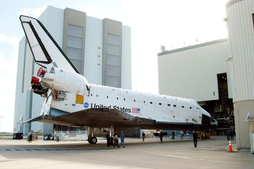 KENNEDY SPACE CENTER, FLA. -  The orbiter Atlantis rolls toward the Orbiter Processing Facility after spending 10 days in the Vehicle Assembly Building.  The hiatus in the VAB allowed work to be performed in the OPF that can only be accomplished while the bay is empty. Work included annual validatio