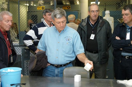 KENNEDY SPACE CENTER, FLA. -- From left, United Space Alliance (USA) Deputy Space Shuttle Program Manager of Operations Loren Shriver, USA Associate Program Manager of Ground Operations Andy Allen, NASA Deputy Associate Administrator for Space Station and Shuttle Programs Michael Kostelnik, and USA 