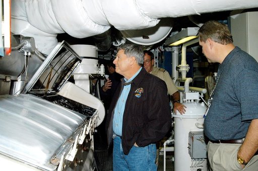 KENNEDY SPACE CENTER, FLA. -- NASA Deputy Associate Administrator for Space Station and Shuttle Programs Michael Kostelnik (left) tours a solid rocket booster (SRB) retrieval ship at Cape Canaveral.  NASA and United Space Alliance (USA) Space Shuttle program management are participating in a leaders