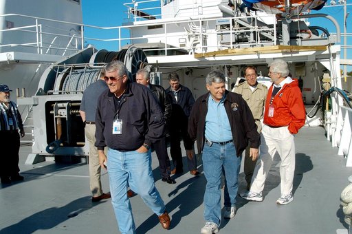 KENNEDY SPACE CENTER, FLA. -- United Space Alliance (USA) Vice President and Associate Program Manager of Florida Operations Bill Pickavance (left front) and NASA Deputy Associate Administrator for Space Station and Shuttle Programs Michael Kostelnik (right front) tour a solid rocket booster (SRB) r