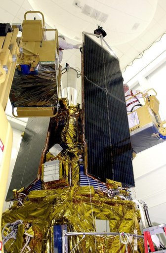 VANDENBERG AFB, CALIF. -  In the NASA spacecraft processing facility on North Vandenberg Air Force Base, workers prepare to attach the top of a solar array panel onto the Gravity Probe B spacecraft.  Installing each array is a 3-day process and includes a functional deployment test.  The Gravity Pro