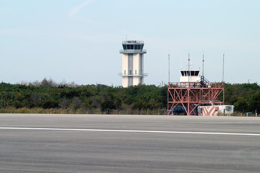 KENNEDY SPACE CENTER, FLA. -- Two control towers are seen at the edge of the KSC Shuttle Landing Facility, the old one in front and the nearly completed new tower in back.  The old tower stands only 20 feet above the runway surface, too low to see the launch pads to the east. During nighttime landin
